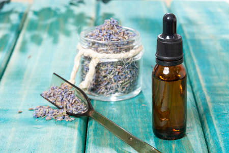 Lavandula Angustifolia - Lavender Essential Oil Glass Bottle With Dried Lavender Flowers