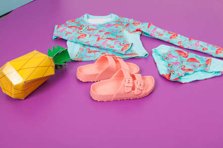 Fashion kids - Girls swimwear of two pieces with flip flops.