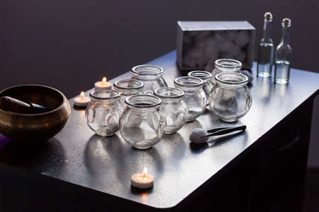 Wellness and health - Glass jars for massage and therapy in the spa.