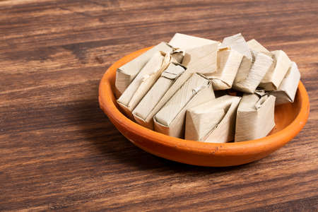 Guava Paste Wrapped in Bijao Leaf; Photo On Wood Background