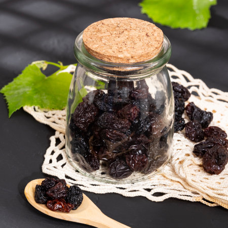 Healthy Food - Nuts Dehydrated Grapes; Photo On Dark Backgroundの写真素材
