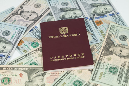 Travel Concept, Colombian Passport With Dollar Bills For Travel Abroad.の写真素材
