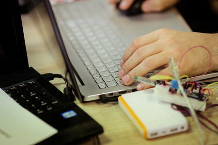 Man uses laptop for coding software
