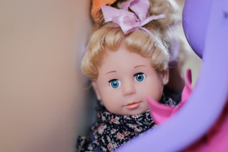 Plastic doll in a child's roomの写真素材
