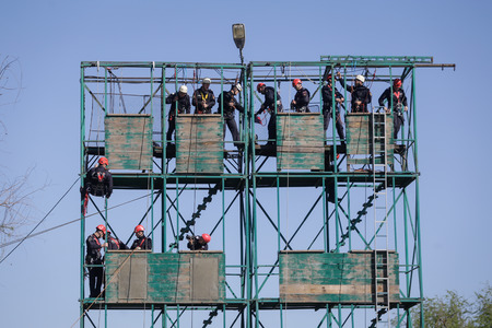 BUCHAREST, ROMANIA - APRIL 21: Firefighters are rappelling and climbing ropes at a drill exercise,...