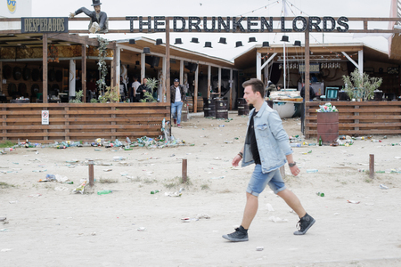 VAMA VECHE, ROMANIA - MAY 1, 2018: Garbage (especially empty bottles), after an all night party, early in the morning just before sunriseのeditorial素材