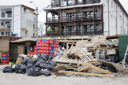 VAMA VECHE, ROMANIA - MAY 1, 2018: Garbage (especially empty bottles), after an all night party, early in the morning just before sunriseのeditorial素材