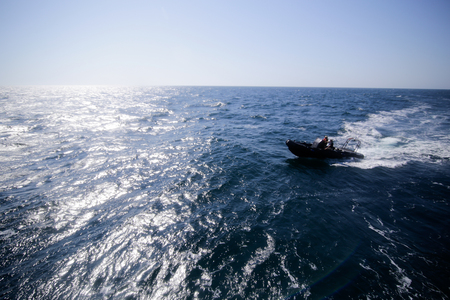 CONSTANTA, ROMANIA - JUNE 24, 2018 - Military rubber boat speeding on water near the city of Constanta, on June 24, 2018.のeditorial素材