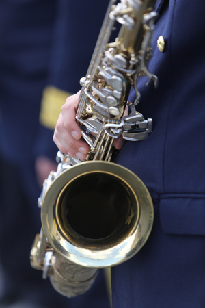 Details of a military parade band member holding a saxophoneの写真素材