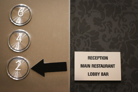 Details with the braille floor buttons on a modern elevator in a luxury hotelの写真素材