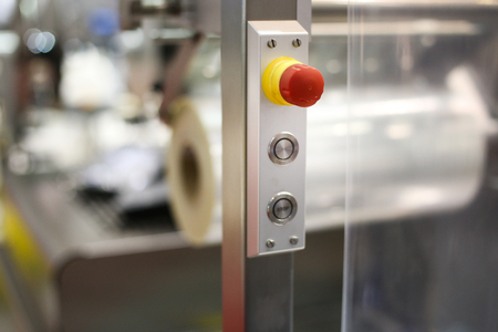 Emergency ON/OFF industrial switch of a food industry equipment. Emergency stop