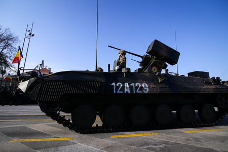 BUCHAREST, ROMANIA - December 1, 2018: MLI 84 M combat armored vehicle at Romanian National Day military parade passes under the Arch of Triumphのeditorial素材