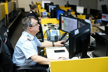 Bucharest, Romania - February 11, 2019: 112 emergency number operator (Romanian version of 911) having a conversation with a distress callerのeditorial素材