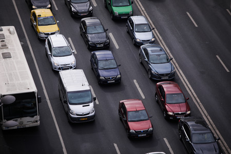 Bucharest, Romania - February 26, 2019: Cars in traffic on a boulevard seen from above, in...