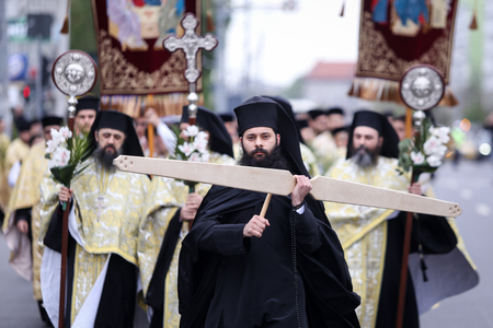 Bucharest, Romania - April 20, 2019: Romanian Orthodox priests during a Palm Sunday pilgrimage...