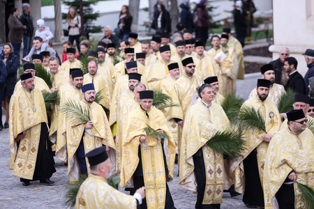 Bucharest, Romania - April 20, 2019: Romanian Orthodox priests during a Palm Sunday pilgrimage...