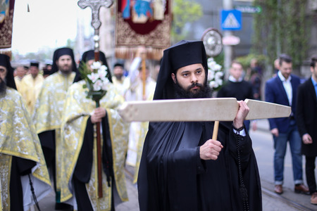 Bucharest, Romania - April 20, 2019: Romanian Orthodox priests during a Palm Sunday pilgrimage...