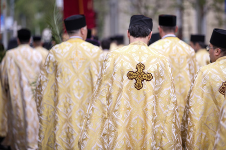 Bucharest, Romania - April 20, 2019: Romanian Orthodox priests during a Palm Sunday pilgrimage...