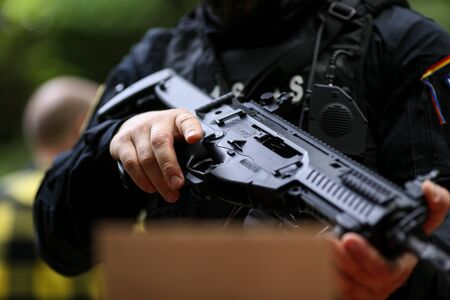 Bucharest, Romania - June 10, 2019: Details of a Romanian SIAS (the service for special action of the Romanian Police, equivalent of SWAT in the US) officer holding a Beretta ARX 160 tactical rifleのeditorial素材