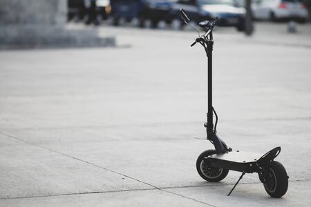 Shallow depth of field image with a parked electrical scooter in downtown Bucharestの写真素材
