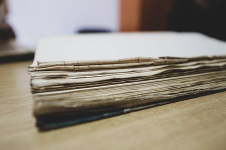 Old papers, books and documents containing historical archivesの写真素材