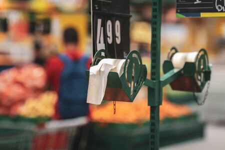 Biodegradable plastic food bags in the fruits and vegetables aisle in a big hypermarket in Romaniaの写真素材
