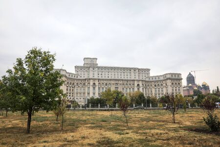 Bucharest, Romania - May 29, 2019:  Romanian Palace of Parliament and the construction site of âCatedrala Mantuirii Neamuluiâ (People's Salvation Cathedral), an christian orthodox cathedral in Bucharest, Romaniaのeditorial素材