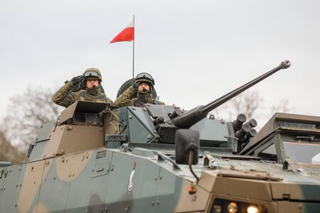 BUCHAREST, ROMANIA - December 1, 2019: Polish soldiers in a ROSOMAK armored vehicle at the Romanian...