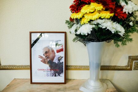 Bucharest, Romania - January 10, 2020: Picture showing iranian general Qassim Soleimani and flowers...