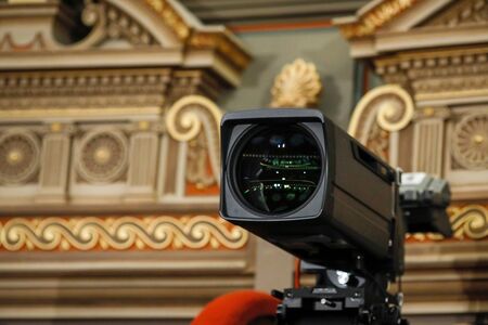 Details with a professional camera inside a classical music hall.の写真素材