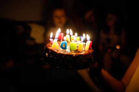 Shallow depth of field (selective focus) image with details of a birthday cake for a child with the...