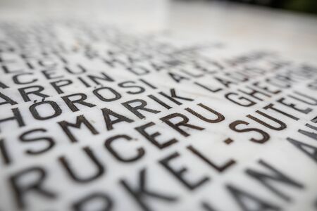 Popesti Leordeni, Romania - December 20, 2019: Shallow depth of field (selective focus) image with names of victims of the Romanian Revolution from december 1989 on a monument.のeditorial素材