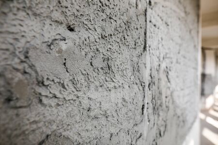 Shallow depth of field (selective focus) image with a wall in an unfinished building on a hospital...
