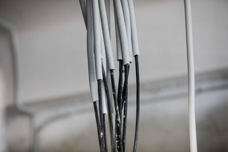 Electricity cables in an unfinished building on a construction site.