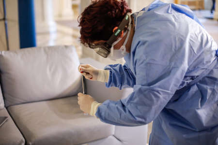 Bucharest, Romania - March 13, 2020: Details with the hands of a medic using a coronavirus test on a person.のeditorial素材