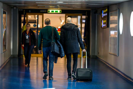 Otopeni, Romania - February 25, 2020: Passengers inside Henri Coanda International Airport, near...