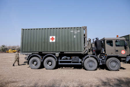 Otopeni, Romania - February 19, 2020: Personnel of the Romanian Army work on the installation of a campaign mobile hospital (ROL 2) to treat Covid-19 patients.のeditorial素材