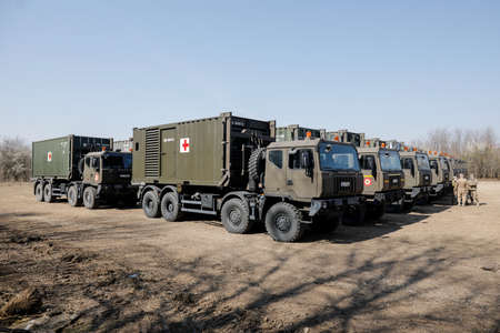 Otopeni, Romania - February 19, 2020: Personnel of the Romanian Army work on the installation of a campaign mobile hospital (ROL 2) to treat Covid-19 patients.のeditorial素材