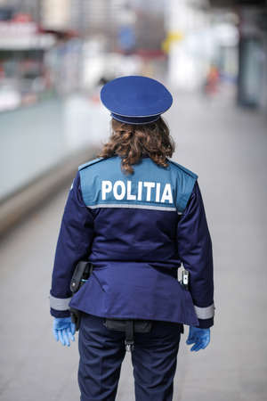 Bucharest, Romania - March 25, 2020: Romanian police female officer.のeditorial素材