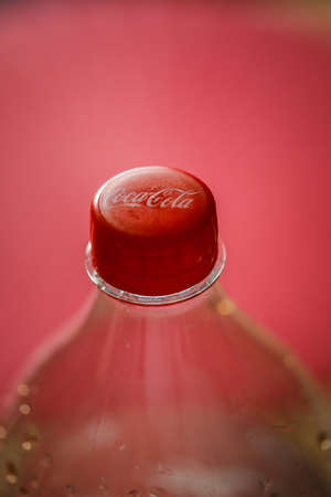 Bucharest, Romania - April 3, 2020: Macro shallow depth of field image (selective focus) with the plastic bottle cap of a Coca Cola bottle.のeditorial素材