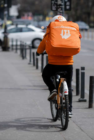 Bucharest, Romania - March 28, 2020: Takeaway delivery in downtown Bucharest during the covid-19 lockdown.のeditorial素材