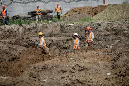 Bucharest, Romania - May 14, 2020: Asian construction workers on a construction site in Bucharest.のeditorial素材