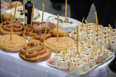 Bucharest, Romania - June 13, 2020: Orthodox Christian funeral cake during a ceremony.のeditorial素材