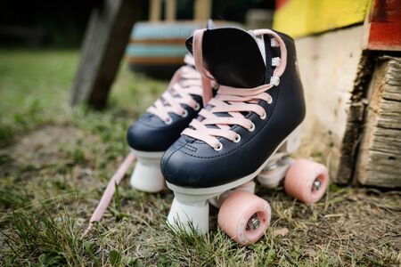 Details with black and pink roller skates of a little girl.の写真素材