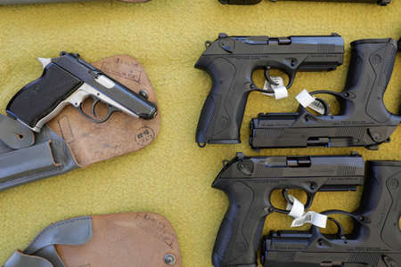 Bucharest, Romania - July 29, 2020: Details with Beretta semi-automatic pistols and the Romanian old Carpati Pistol MD. 1974のeditorial素材