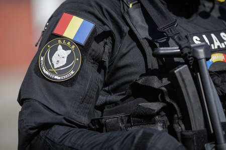 Bucharest, Romania - July 29, 2020: Details with the uniform of an officer from the Special Actions and Intervention Service (SIAS), from the Romanian Police  and the SIAS logoのeditorial素材