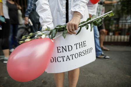 Bucharest, Romania - August 16, 2020: Details with a banner held by a woman during a political rally supporting the protests in Belarus.のeditorial素材