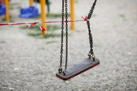 Bucharest, Romania - August 20, 2020: Toys from a playground in a park are being off limits due to the Covid-19 outbreak.のeditorial素材