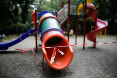 Bucharest, Romania - August 20, 2020: Toys from a playground in a park are being off limits due to the Covid-19 outbreak.のeditorial素材