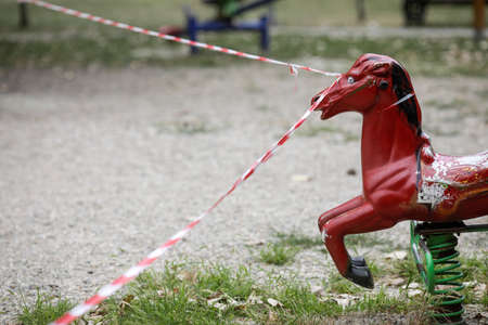 Bucharest, Romania - August 20, 2020: Toys from a playground in a park are being off limits due to the Covid-19 outbreak.のeditorial素材